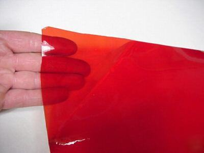 Red transparent vinyl w/ adhesive 24