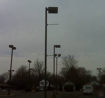 Used ext parking lot light poles approx (5