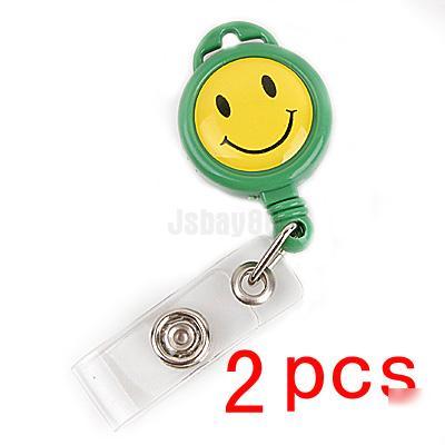 2 green retractable smiley face badge card holder reel