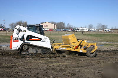 Skid steer scraper attachment, ashland ground hog 2500