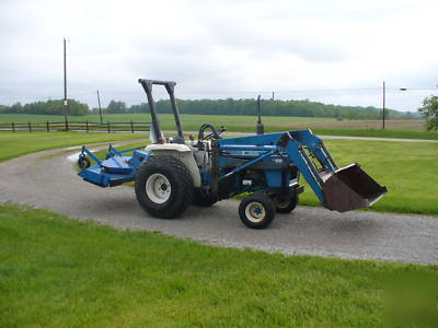 Ford 1500 tractor with rear mower deck and front loader