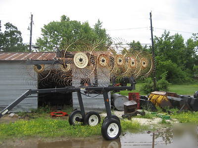 Good used 10 wheel hay rake on cart