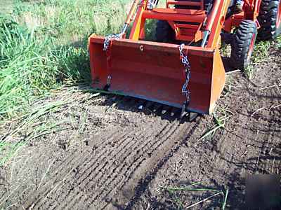 Skidsteer loader bucket teeth tooth bar toothbar debris