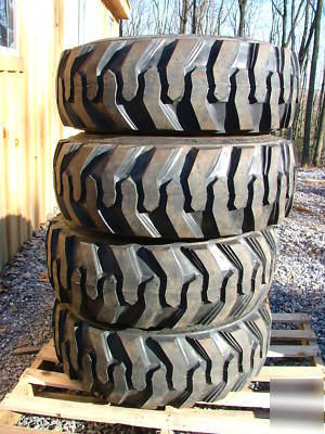 New 4 skid steer tires and rims - 10X16.5 - 10 ply - 