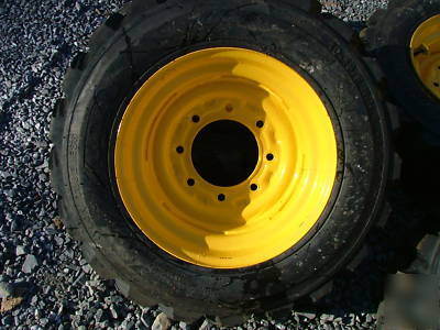 New 4 skid steer tires and rims - 10X16.5 - 10 ply - 
