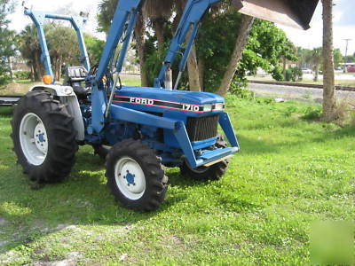  ford 28 hp 4X4 with loader $6800 