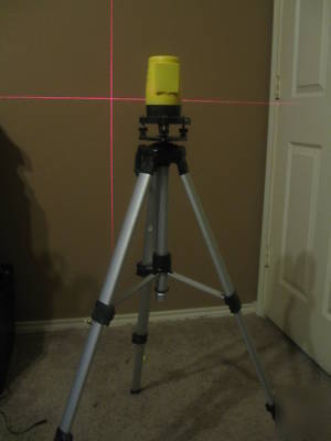 Laser level with vertical and horizontal cross hairs.