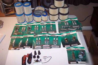 Large lot of onan parts and champion plugs