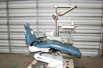 Dental chair with light, del. system & cuspidor