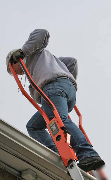 Safety ladder walk-through ladder rail extension